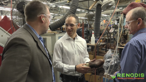 Marc Kermisch, CIO of Red Wing Shoes, shows Renodis how one of their custom shoes is made.